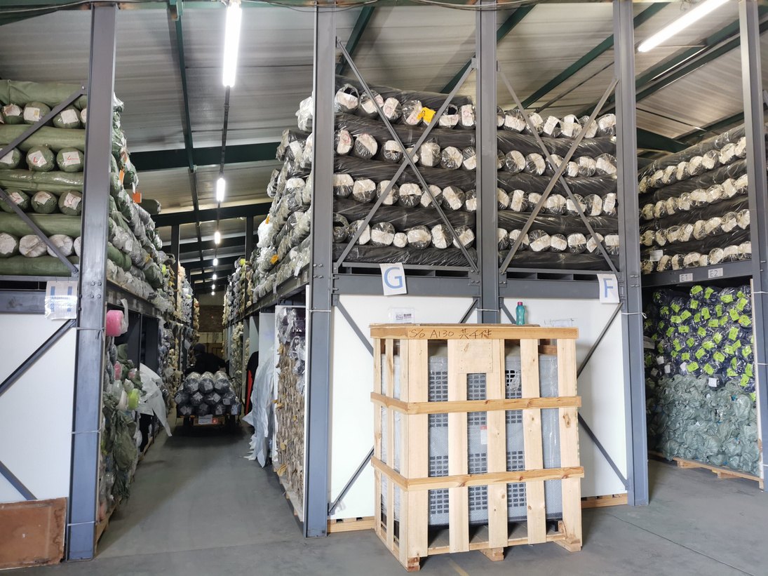 Racked fabric rolls in the Hippo Knitting on-site fabric warehouse